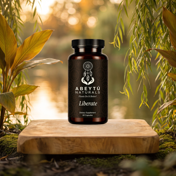 Liberate bottle on a wooden slab by a river at golden hour, among willow and turmeric leaves