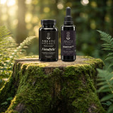 Novalytic and InsuLess bottles on a moss-covered tree stump in a sunlit fern glade